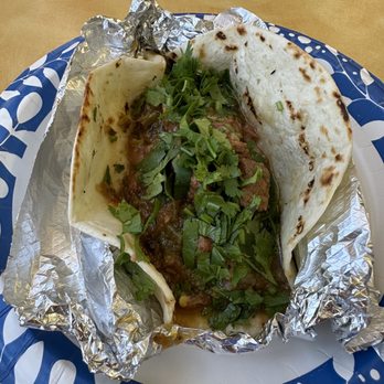 Green Spot Market & Fuels signature dishes Various Tacos (e.g., Green Spot Tacos), Quinoa Salads, Sandwiches, Smoothies, Breakfast Burritos.